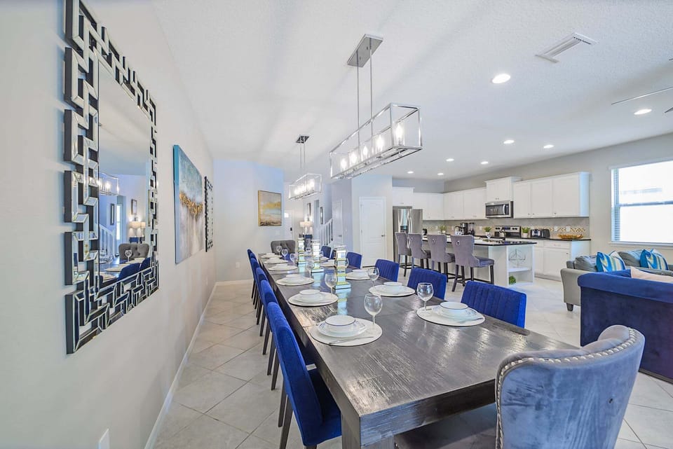 A spacious dining area designed for large families and groups, featuring stylish seating and easy access to the fully equipped kitchen. The open layout creates the perfect setting for shared meals and memorable moments together.