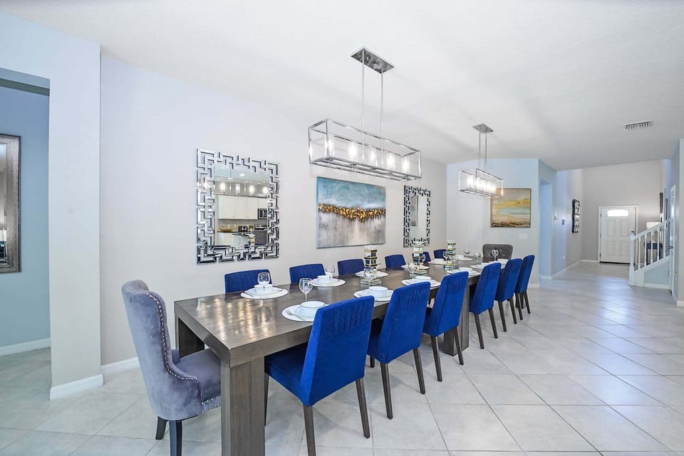 A spacious dining area designed for large families and groups, featuring stylish seating and easy access to the fully equipped kitchen. The open layout creates the perfect setting for shared meals and memorable moments together.