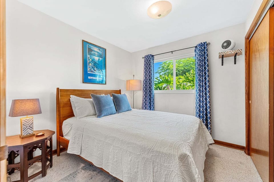 Guest bedroom 1 features a plush queen bed