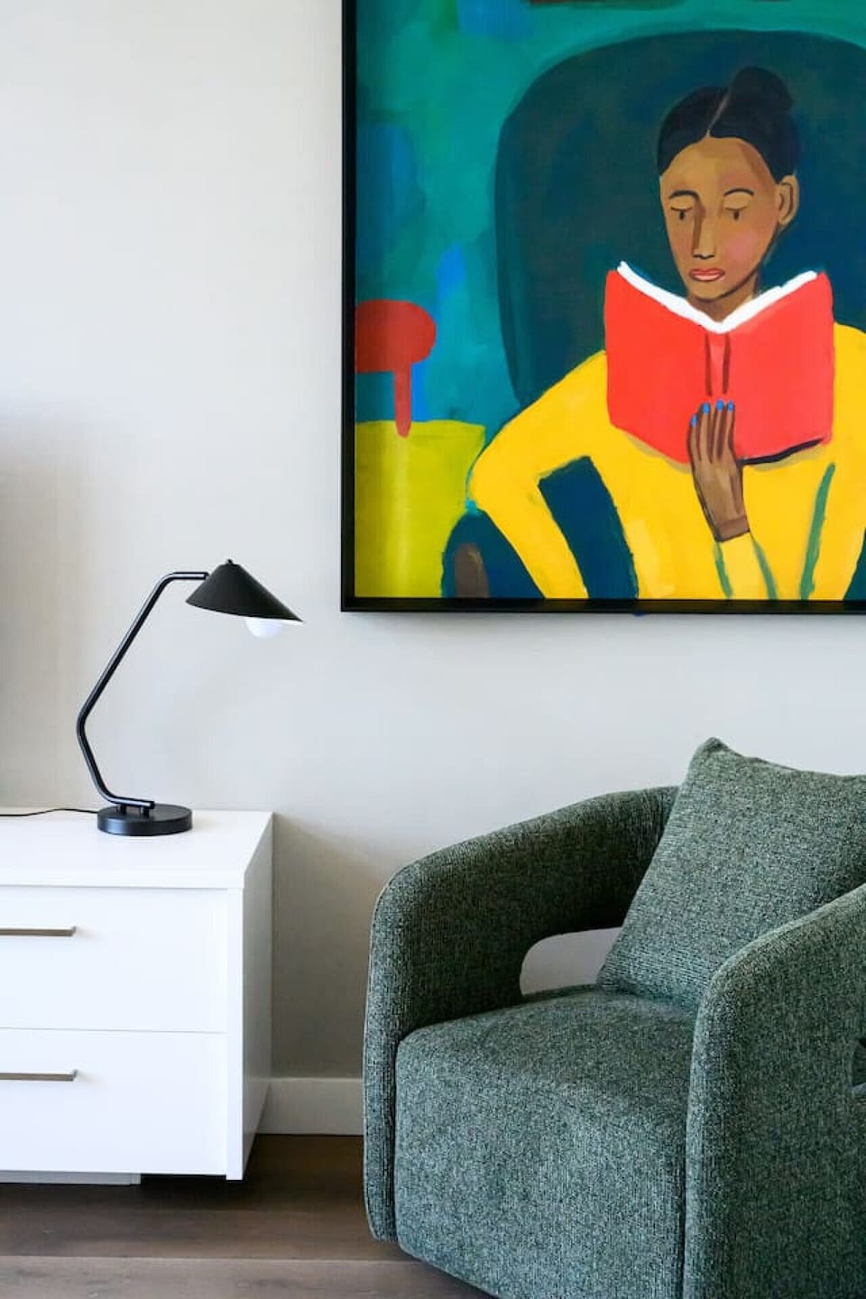 Warm lighting and colorful artwork in the living space