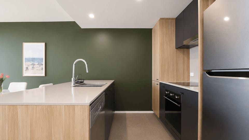 Bright open plan kitchen with breakfast bar