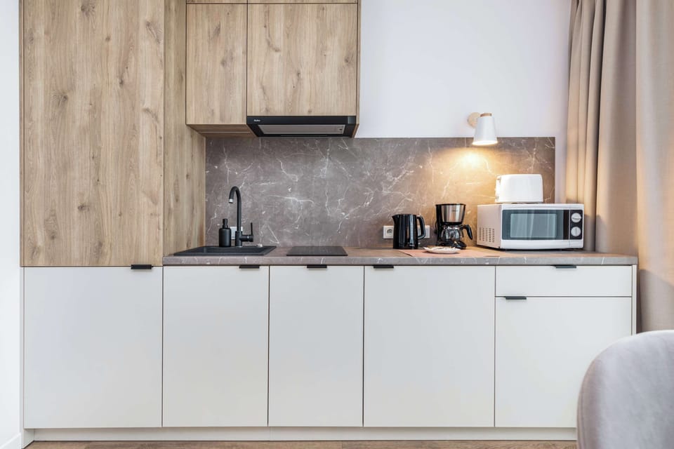 The kitchenttee's modern appliances make meal preparation easy.