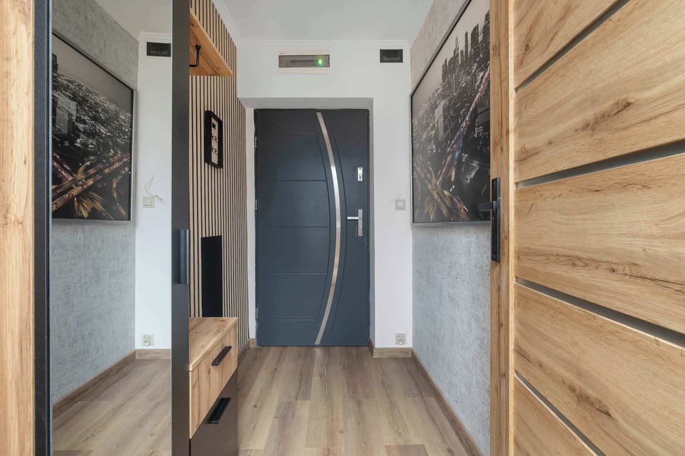 The living room's sleek design is both functional and aesthetically pleasing.