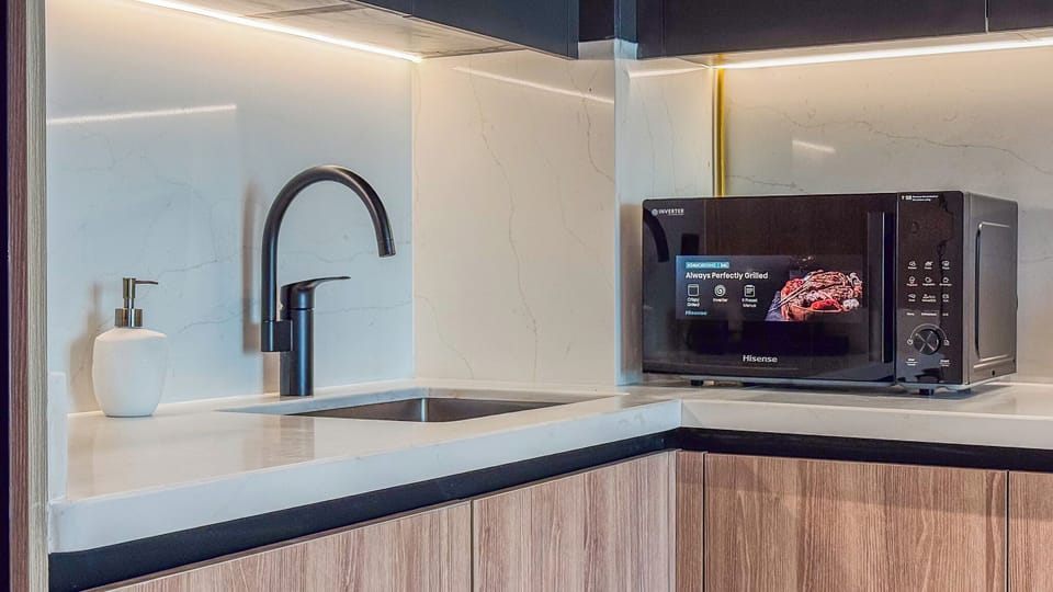 Deluxe Apartment, Balcony, City View | Private kitchen | Espresso maker, coffee/tea maker