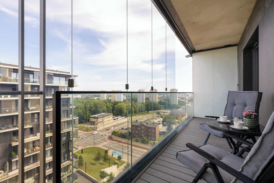 Spacious balcony with comfortable seating and views of the surrounding area.