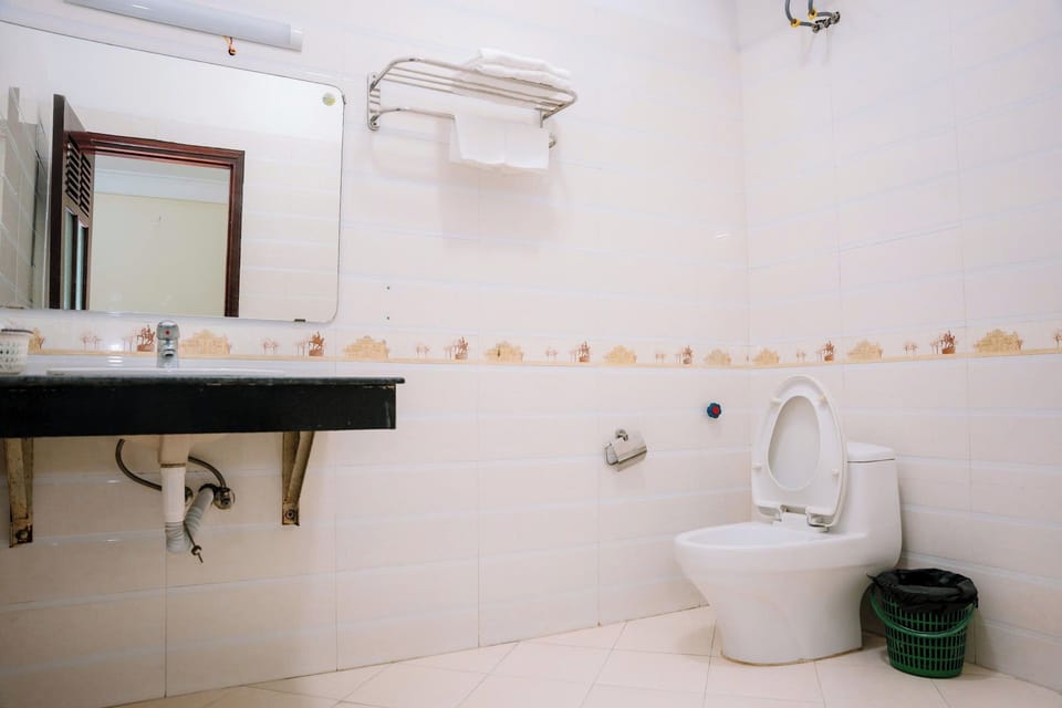 Shower, hair dryer, slippers, towels