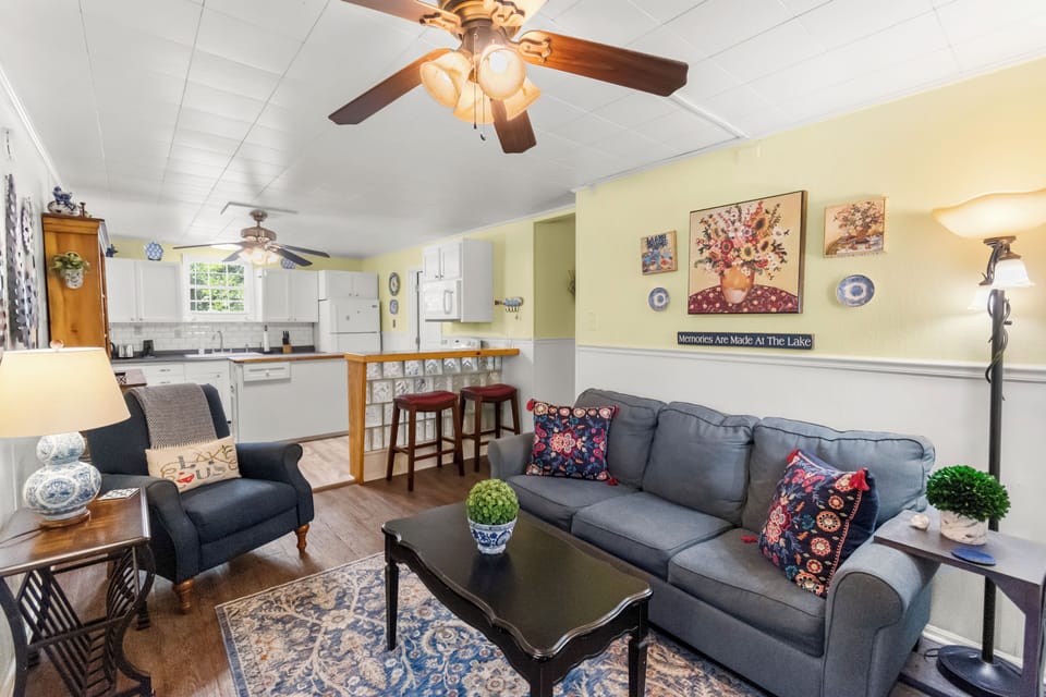 Relax in the welcoming living room with comfortable seating, a television and access to the bedrooms.
