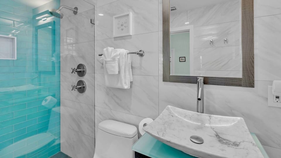 Featuring a glass walk-in shower...