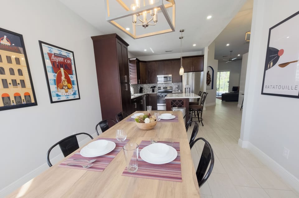 Bright open dining space with modern kitchen and island seating