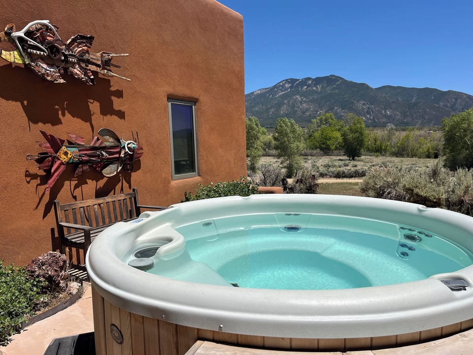 Soak in your private hot tub and take in the peaceful high-desert landscape.