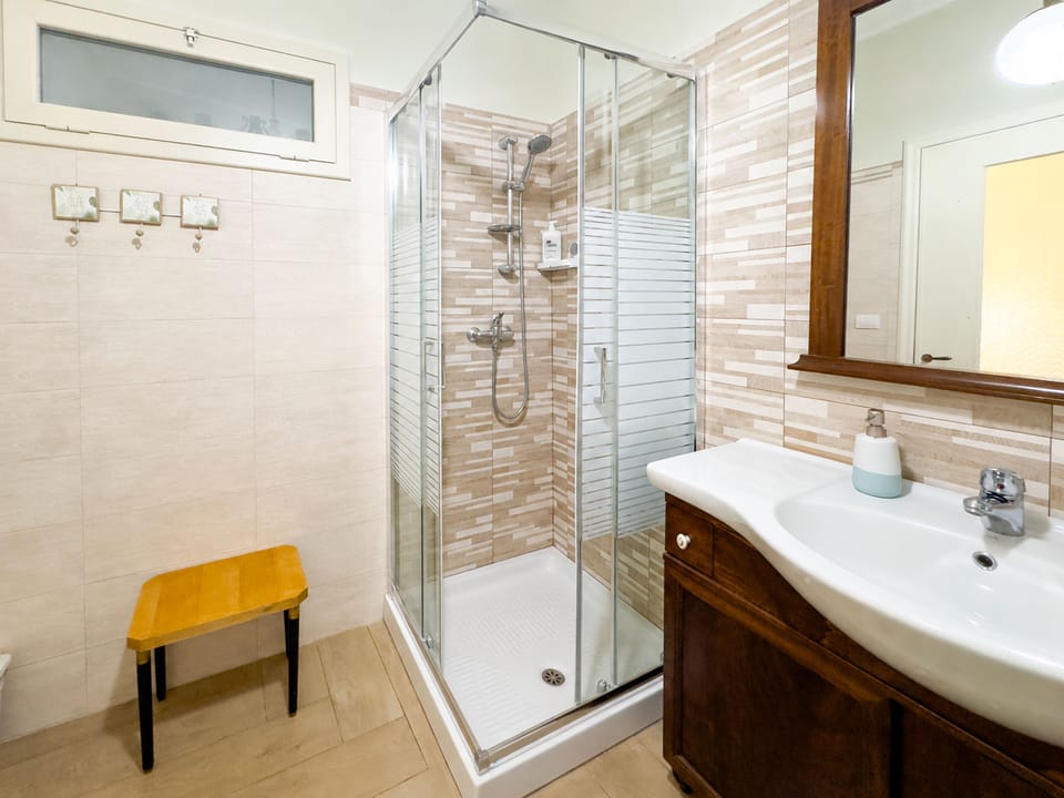 Triple Room | Bathroom | Shower, hair dryer, towels, soap
