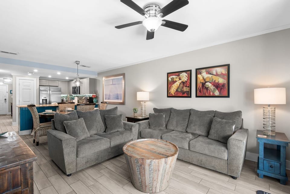 Sink into plush sofas in your open-plan living area, where soothing tones create a welcoming retreat after a full day of exploring.