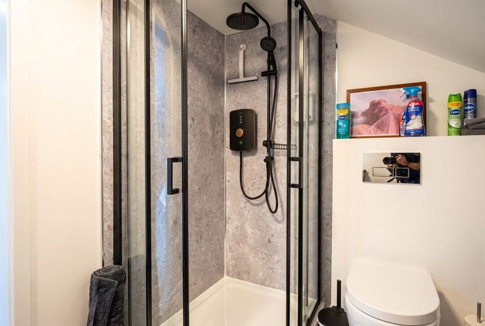 Refresh under the rainfall shower in the sleek modern bathroom