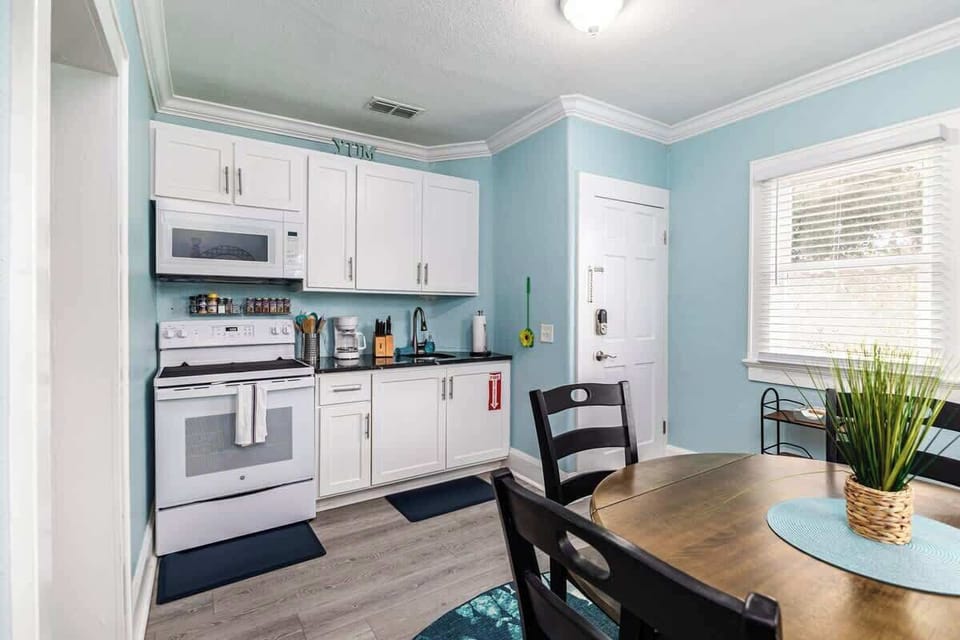 This compact yet fully equipped kitchen meets all your culinary needs. It features a full-sized stove and refrigerator, microwave, toaster, and coffee maker. You’ll also find cookware, spices, and a cozy eat-in area.
