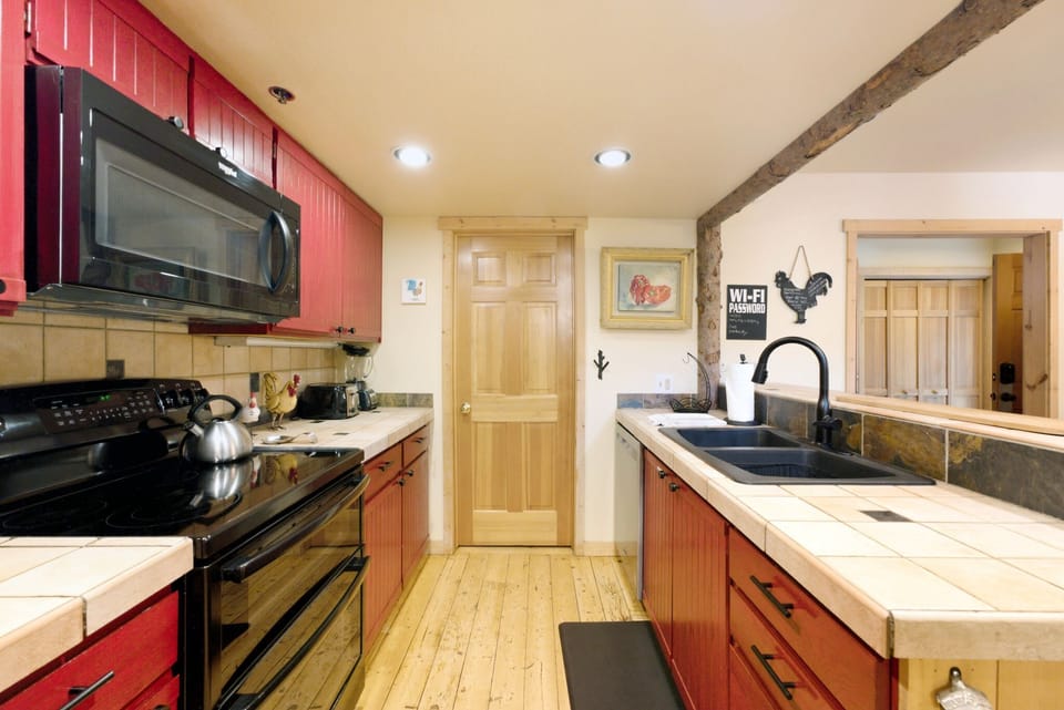 Cook up your favorite meals in this cozy mountain kitchen, equipped with everything you need for easy meal prep during your stay