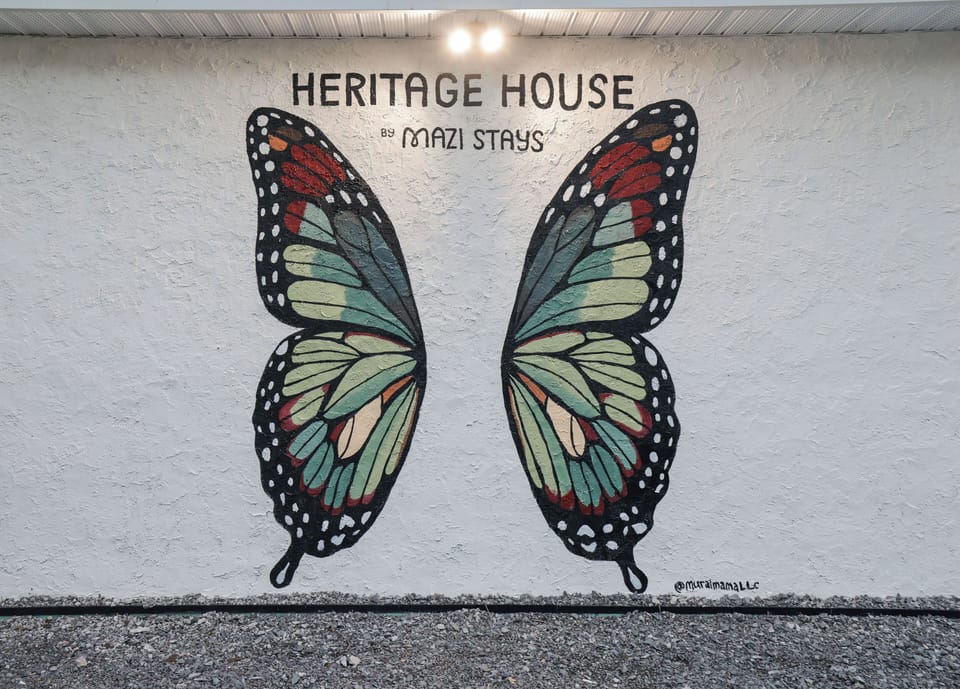Snap the perfect vacation photo with our vibrant butterfly mural!