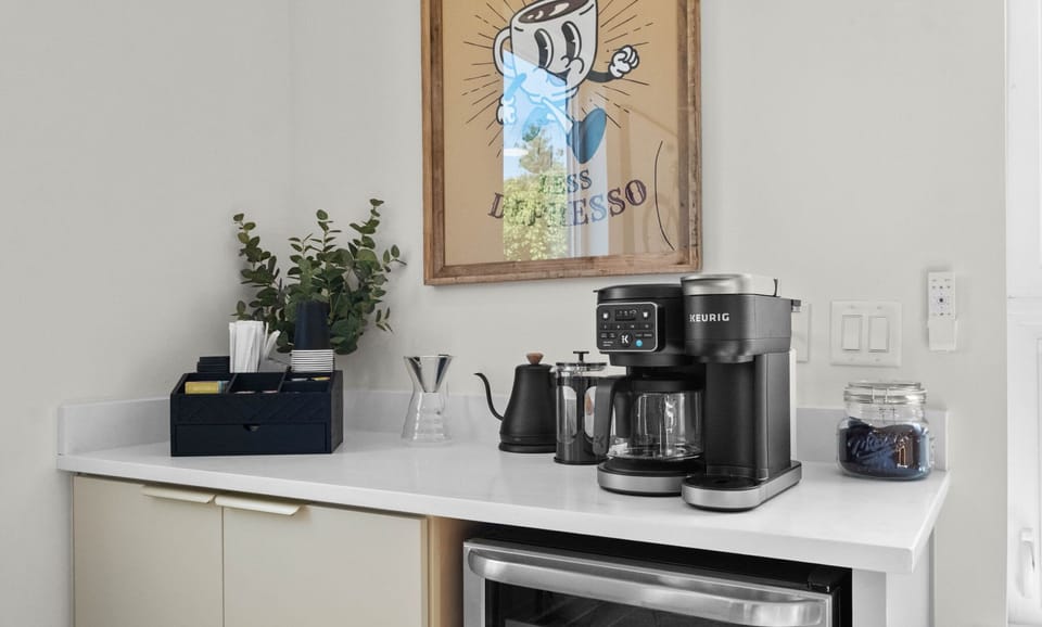 Coffee and tea bar above a beverage cooler in the kitchen
