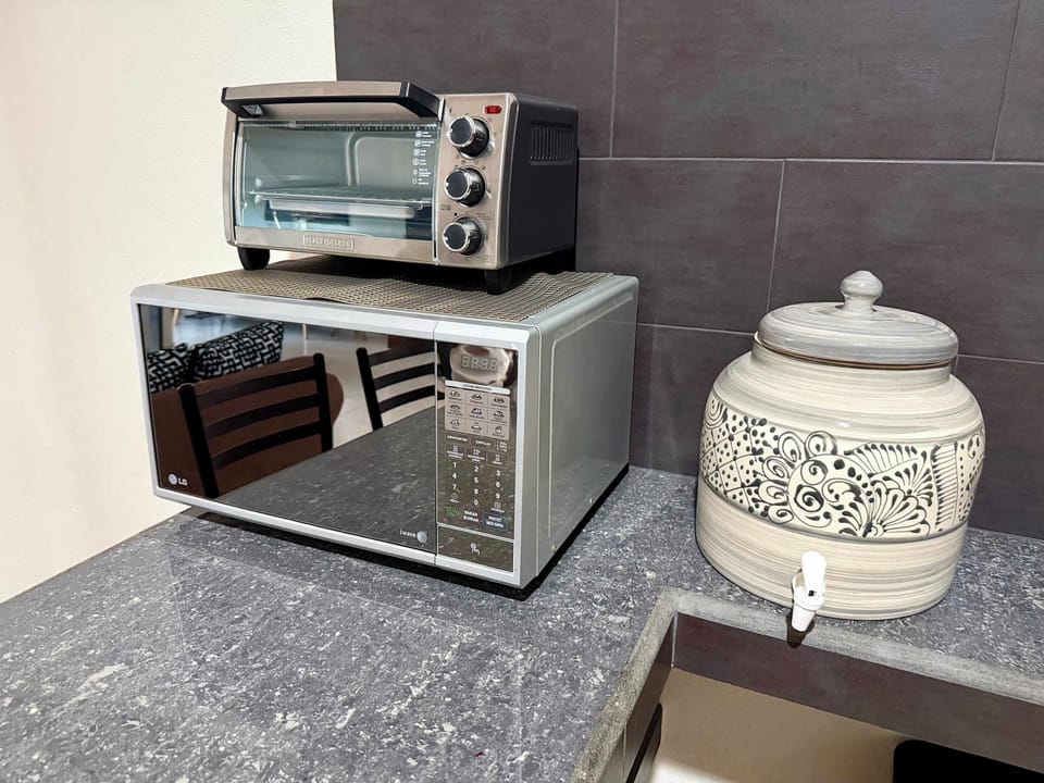 Microwave, toaster oven, and water dispenser.