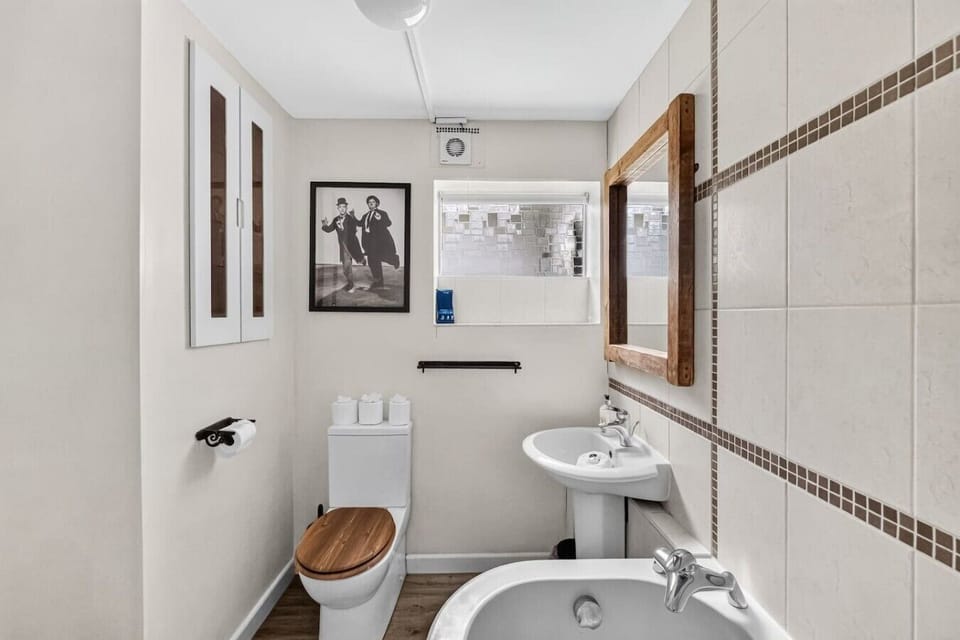 Bathroom featuring a shower over the bath and complimentary toiletries for your convenience.