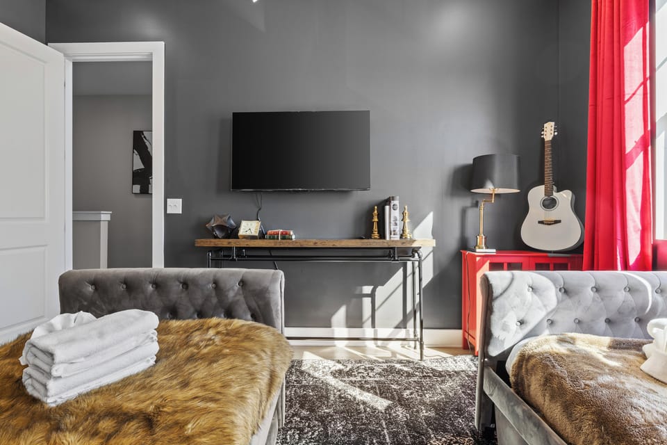 Cozy bedroom with smart TV.