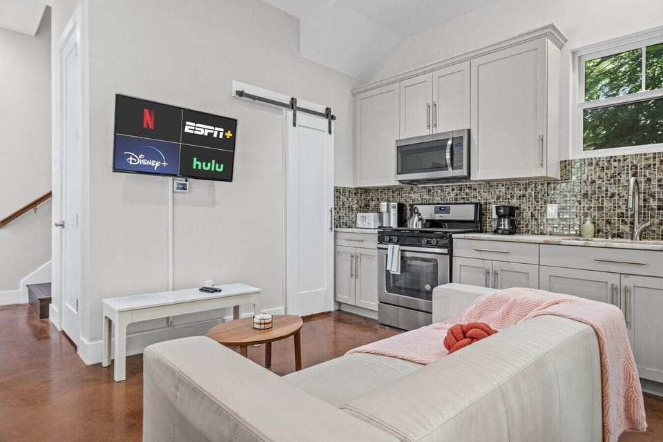 Stream your favorites on the wall-mounted Smart TV with Netflix, Disney+, and Hulu already loaded.