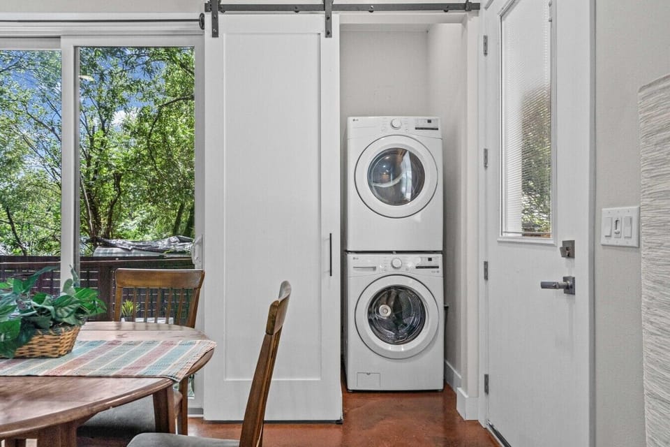 Pack light and keep your travel wardrobe fresh with the in-unit stacked washer and dryer.
