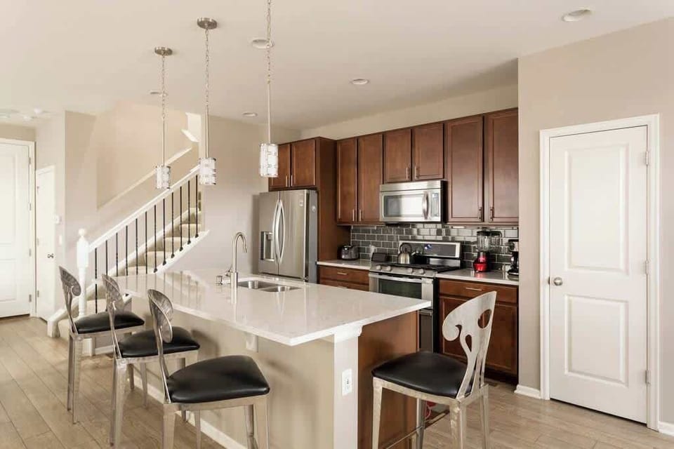 beautiful kitchen with an a clean   island 