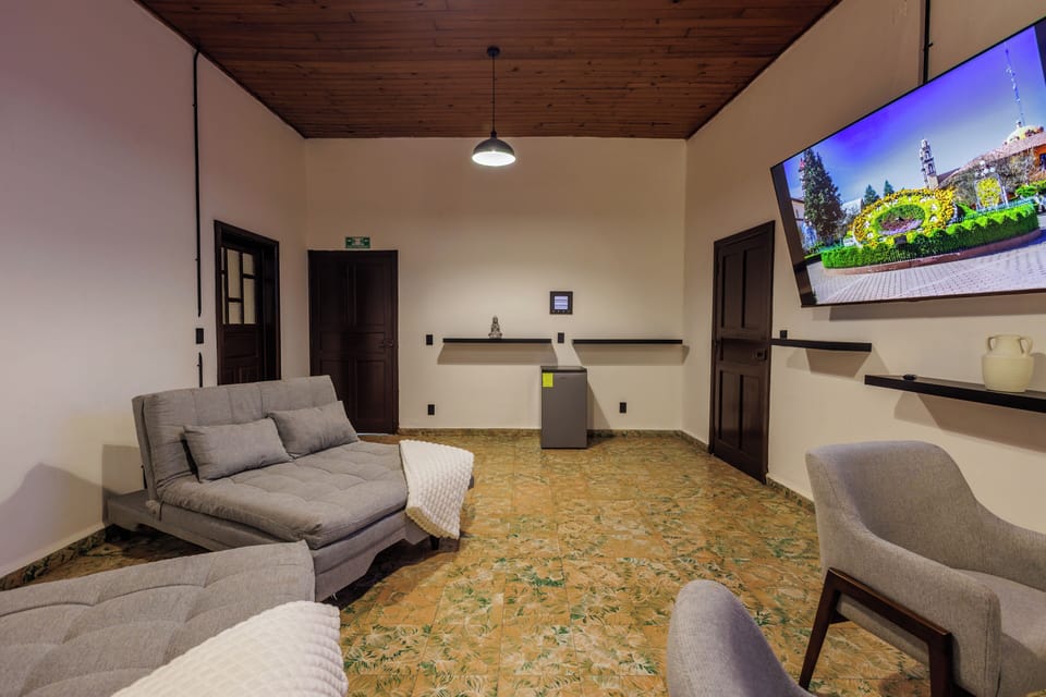 Superior Room | Living room | 75-inch Smart TV with cable channels