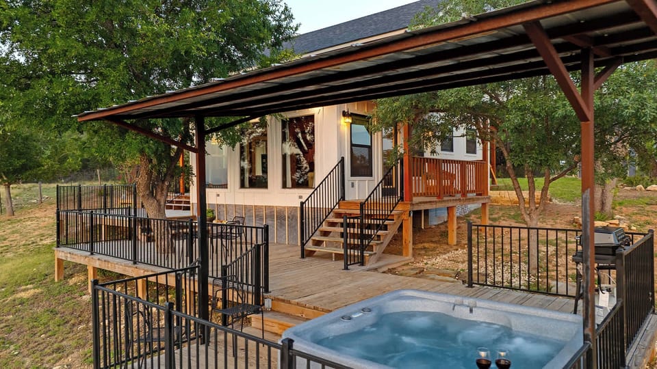 Back/Side of home with Hot tub
