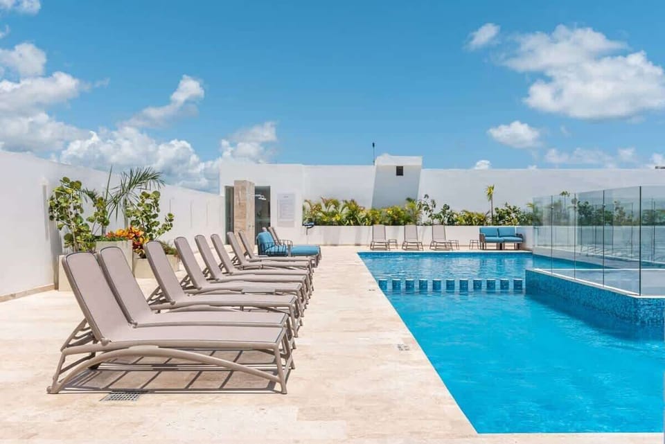 Rooftop pool with ocean views and a relaxed atmosphere