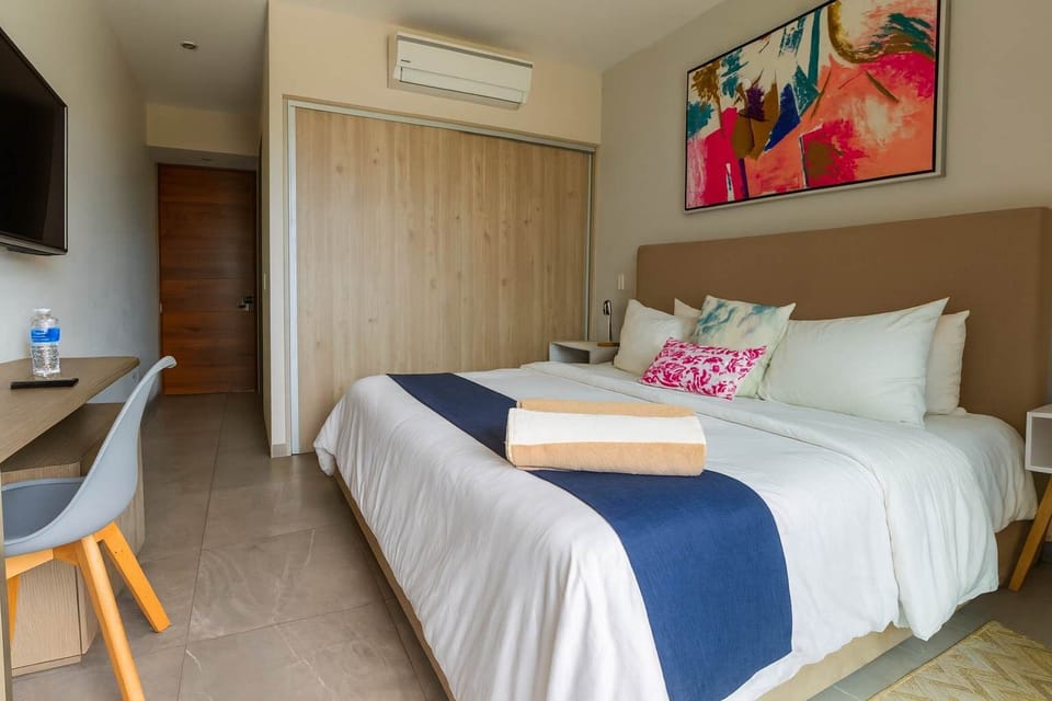Spacious bedroom with a king-size bed.