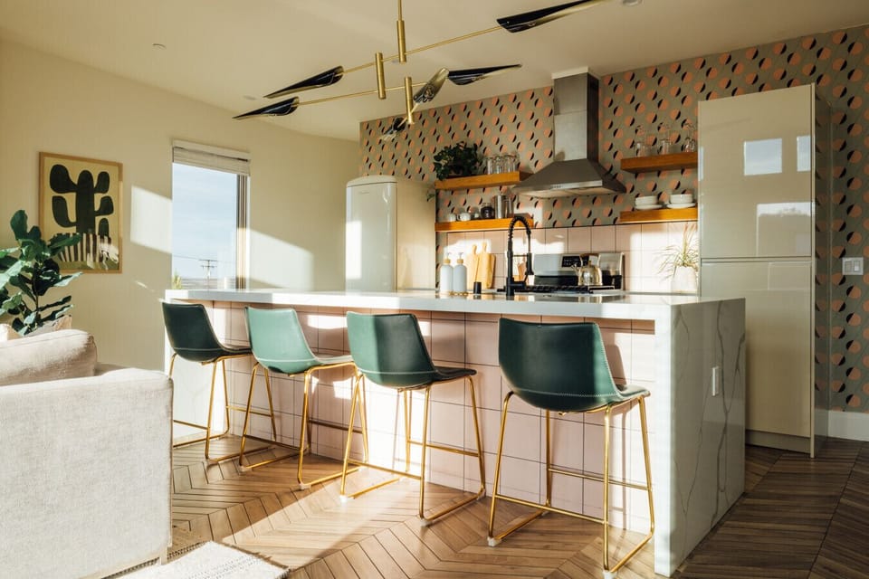 Stylish kitchen with designer touches and island seating.