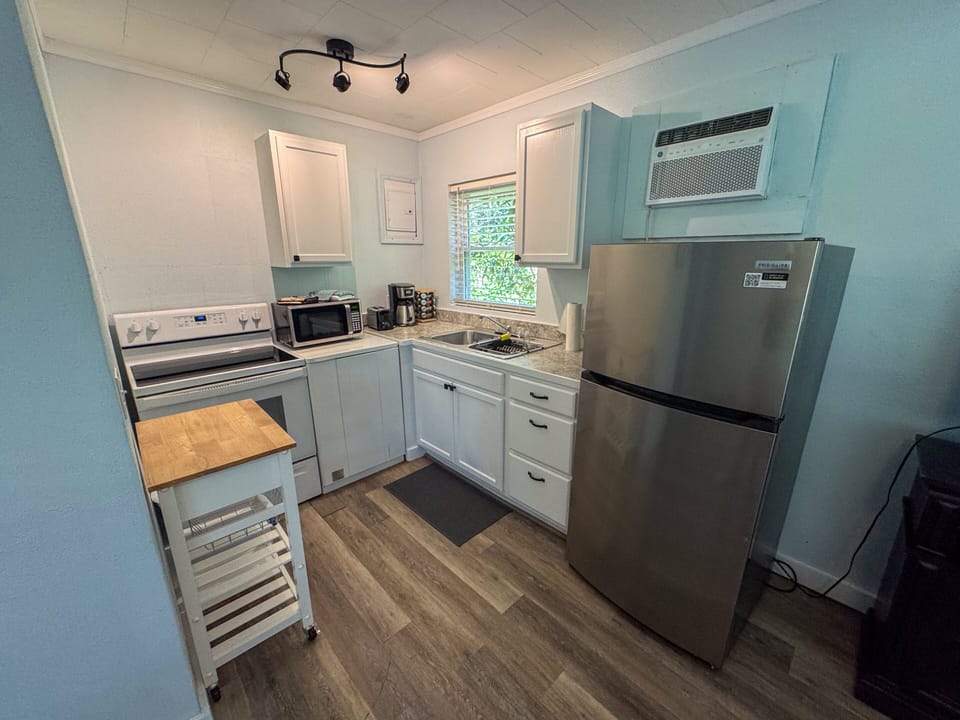 Fully equipped kitchen area, with modern kitchen amenities.