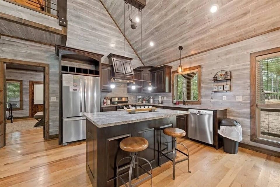 Gourmet kitchen with granite counters and island seating