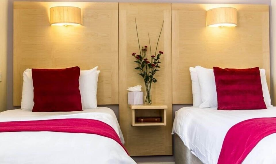 Twin Room | Blackout drapes, iron/ironing board, free WiFi, bed sheets