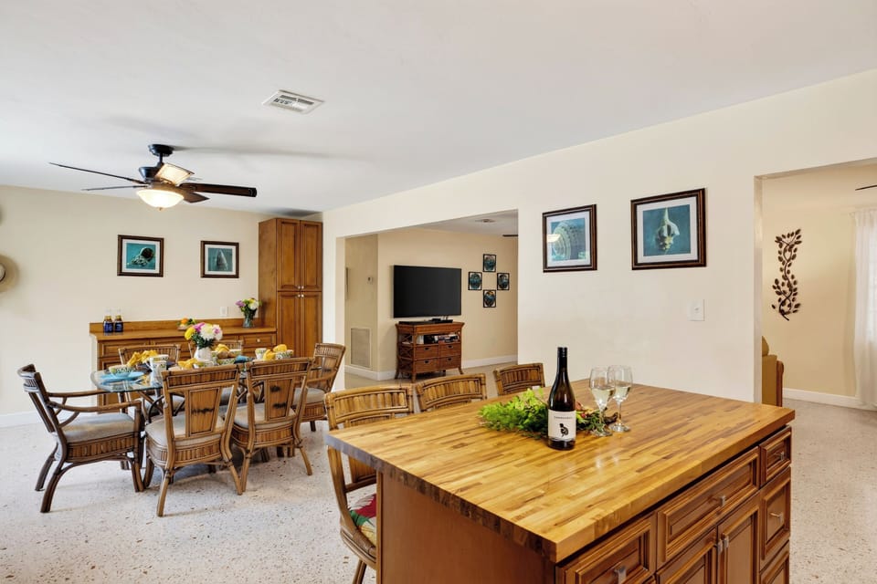 Prepare meals in the well-equipped kitchen, featuring a spacious island with seating for four.