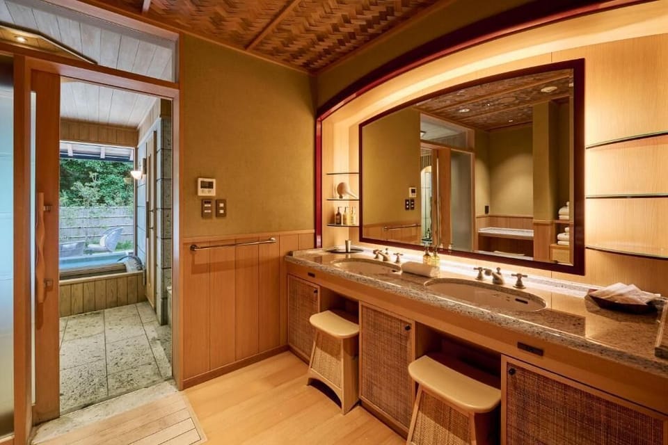 Suite, Garden View | Bathroom | Separate tub and shower, hair dryer, slippers, towels
