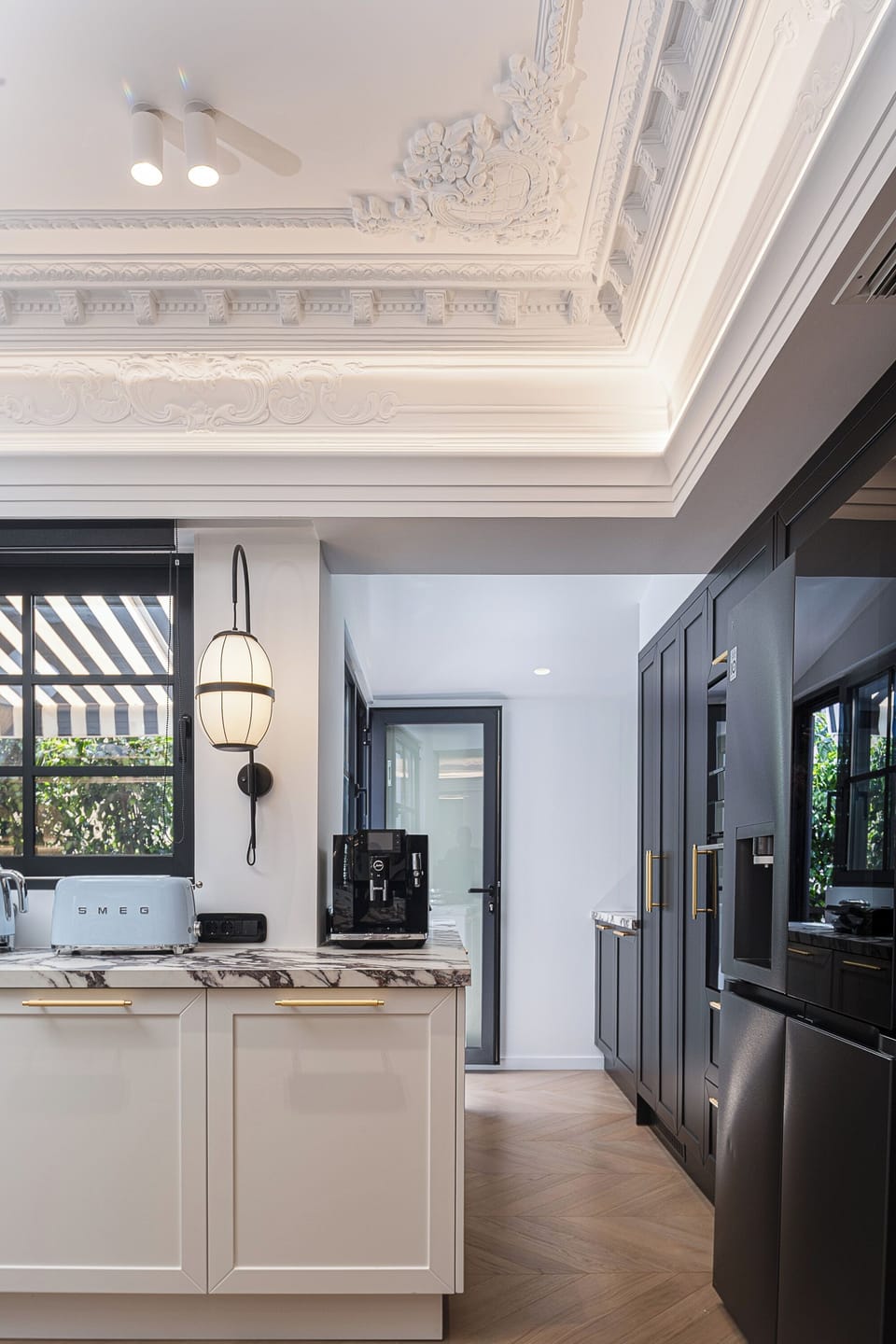 Fully equipped modern kitchen with dishwasher, washer, dryer, and designer finishes—perfect for preparing meals while enjoying a luxury apartment stay in Athens.