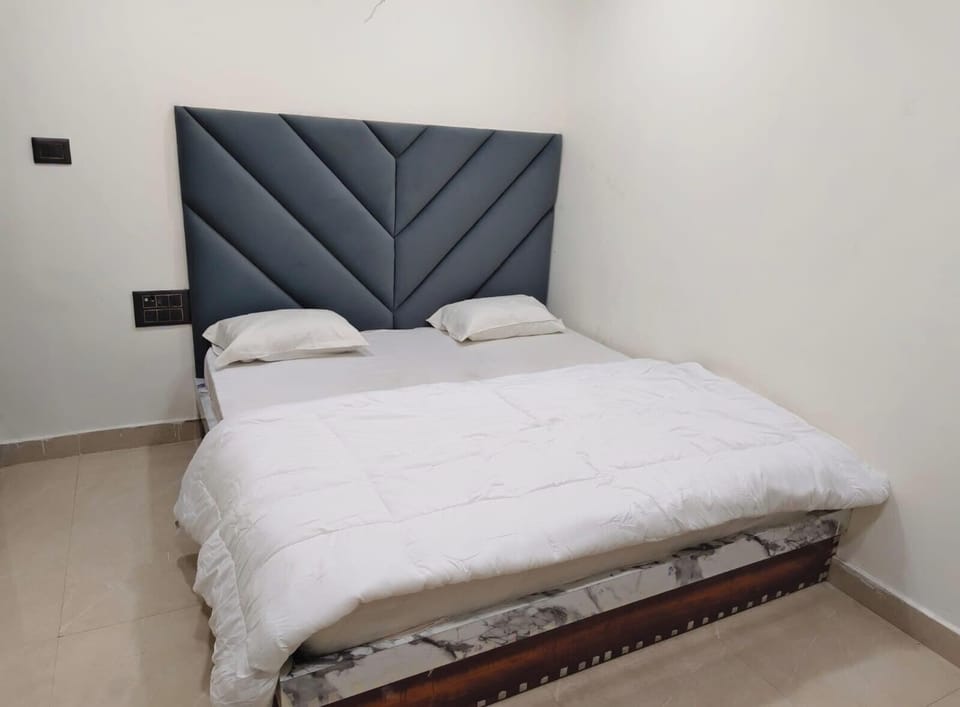 Deluxe Room, City View | In-room safe, desk, laptop workspace, soundproofing