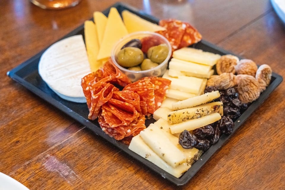 Create the perfect wine night with a charcuterie spread featuring your favorite local cheeses and treats.