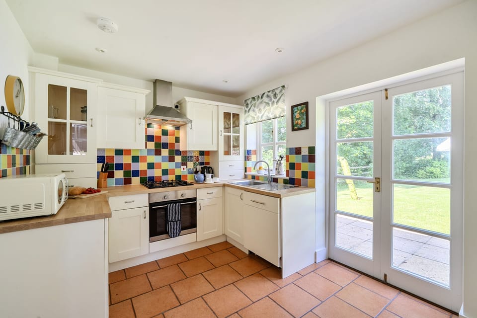 The Old Coach House, Ansty: The kitchen with french doors to the garden