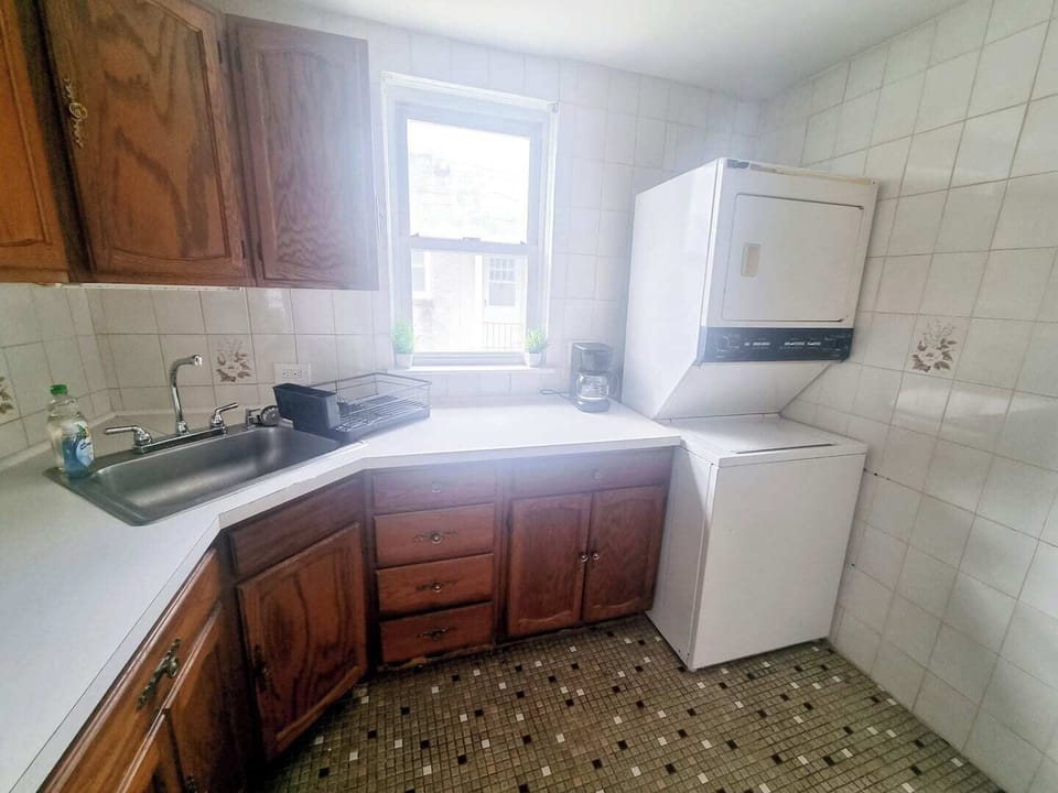 Step into a well-appointed kitchen designed for convenience. It includes a full-sized refrigerator, range, and plenty of counter space for meal prep. You'll find generous storage in the cabinetry, making it easy to keep things organized.
