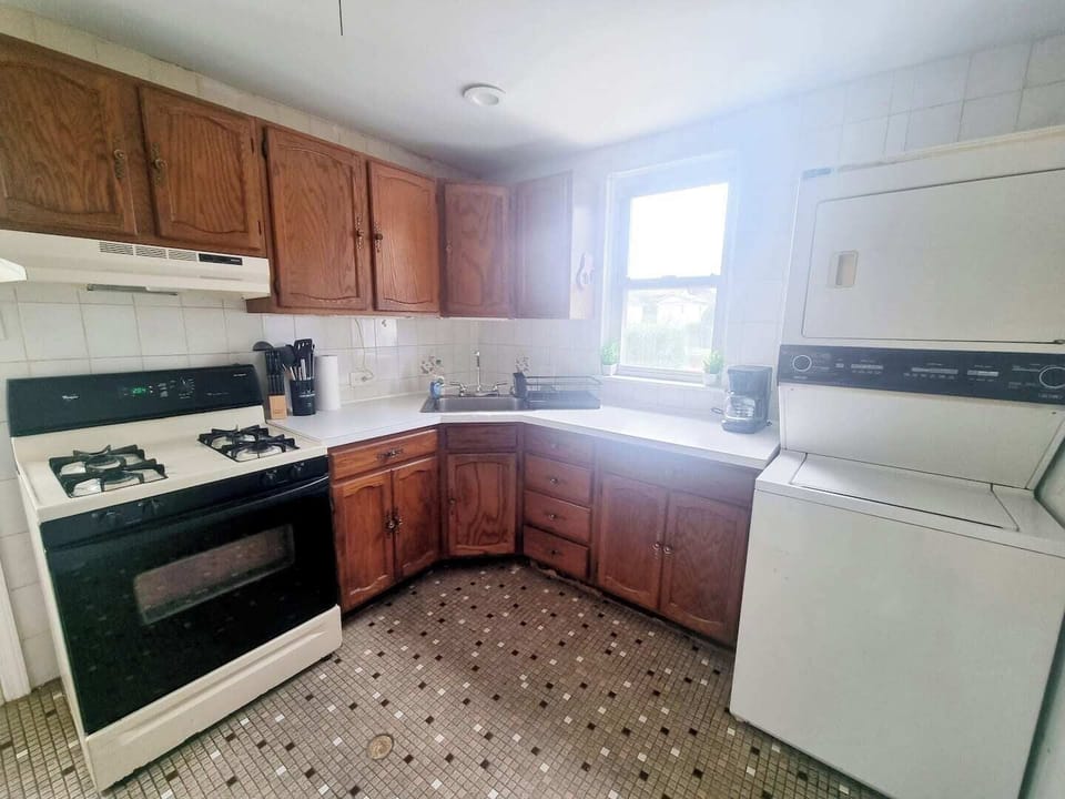 Step into a well-appointed kitchen designed for convenience. It includes a full-sized refrigerator, range, and plenty of counter space for meal prep. You'll find generous storage in the cabinetry, making it easy to keep things organized.
