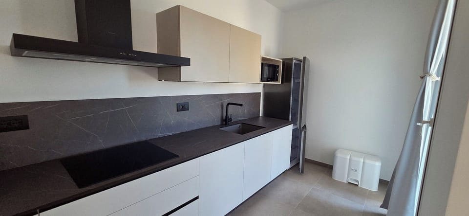 Countertop, Flooring, Kitchen, Interior Design, Floor, Cabinetry, Home, Kitchen Appliance, Room, Furniture