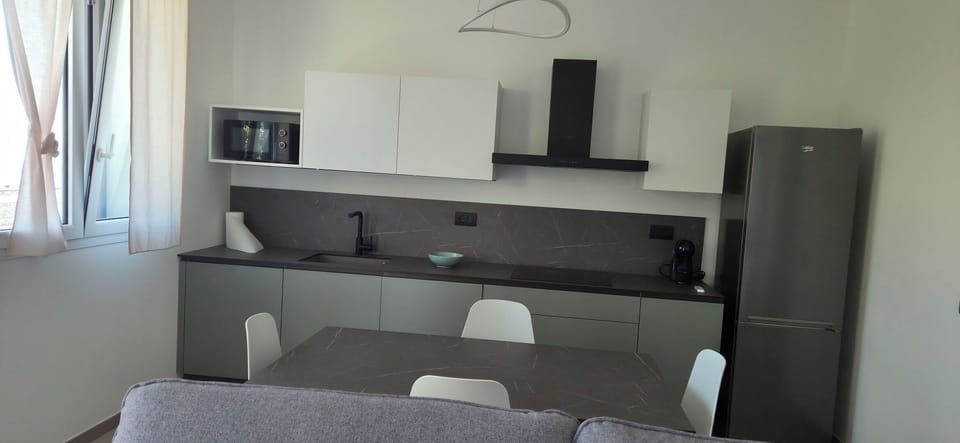 Kitchen, Furniture, Countertop, Kitchen Appliance, Interior Design, Flooring, Major Appliance, Cabinetry, Lighting, Floor