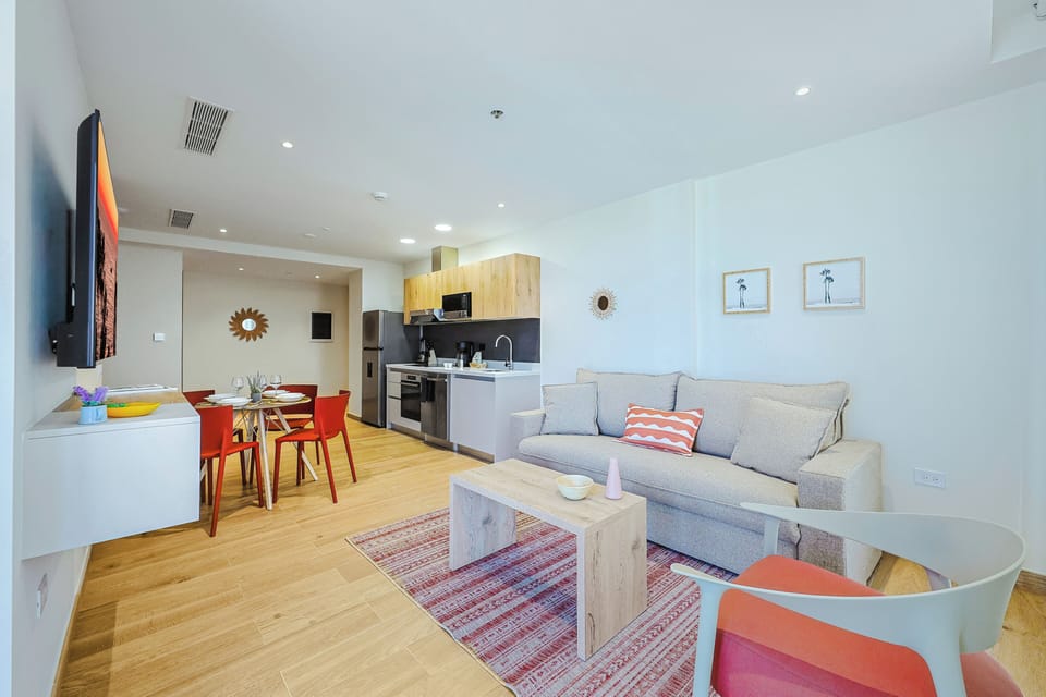 Settle into your open-plan living space where natural light fills every corner. The modern kitchen flows seamlessly into your dining and lounge areas, creating the perfect spot to unwind after exploring.