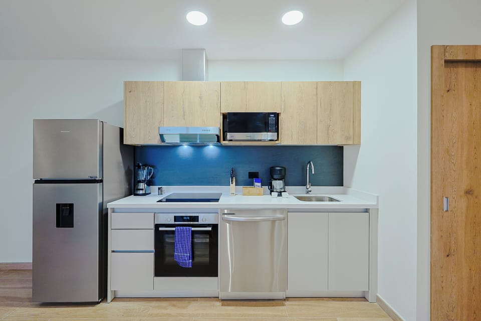 Your sleek kitchen features modern appliances, plenty of counter space, and stylish cabinetry—perfect for preparing meals during your stay.