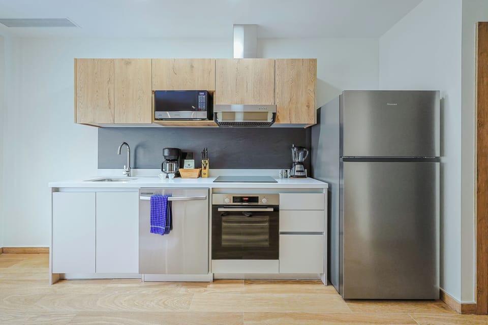 Your sleek kitchen comes fully equipped for easy meal prep, with modern appliances and a minimalist design that makes you feel right at home.