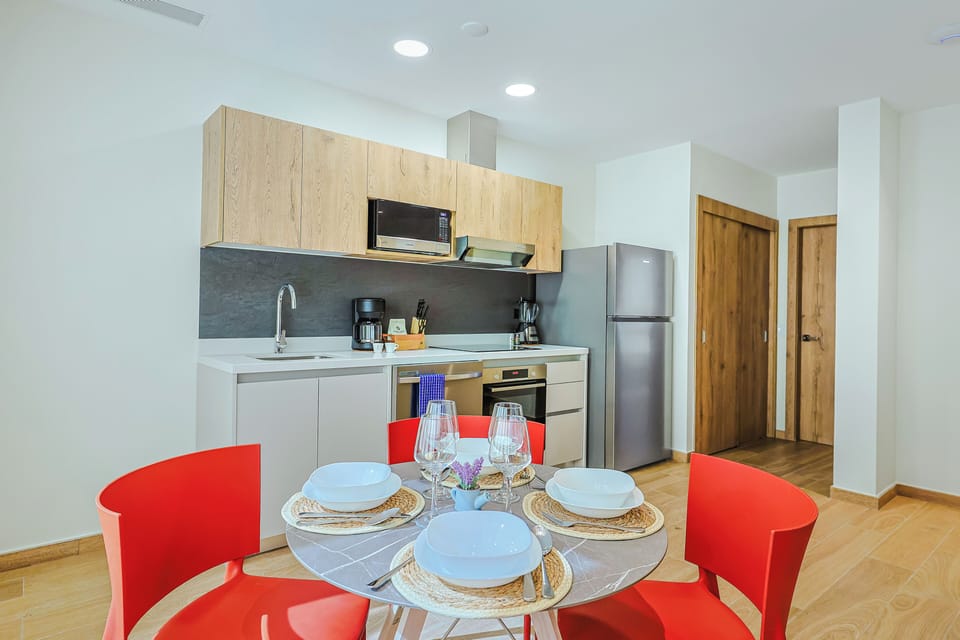 Your bright, well-equipped kitchen awaits, complete with modern appliances and a cheerful dining spot where you can savor home-cooked meals together.