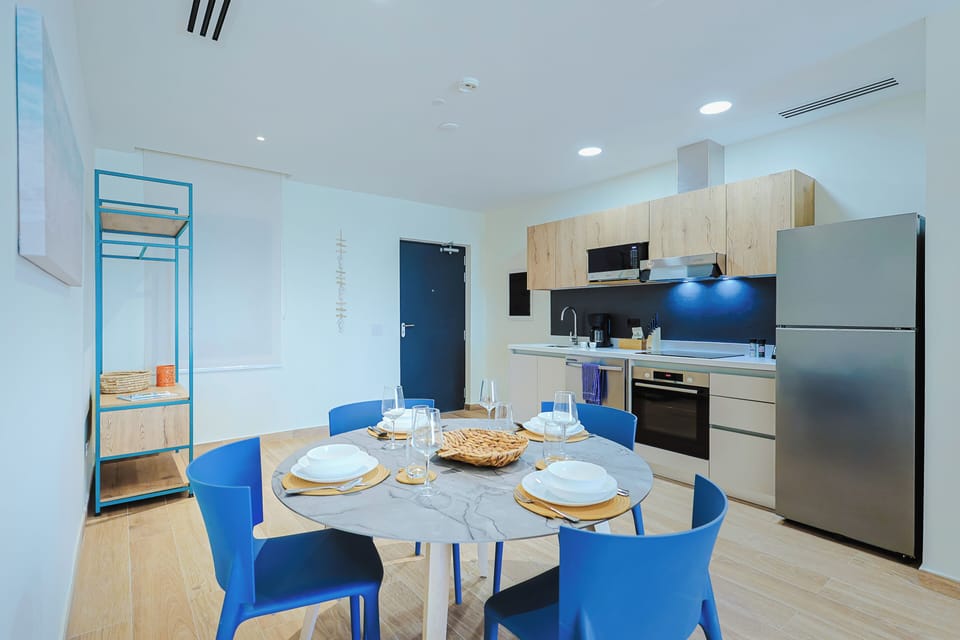 Enjoy meals together in this bright, modern kitchen and dining space with stylish touches and everything you need to cook and dine comfortably.